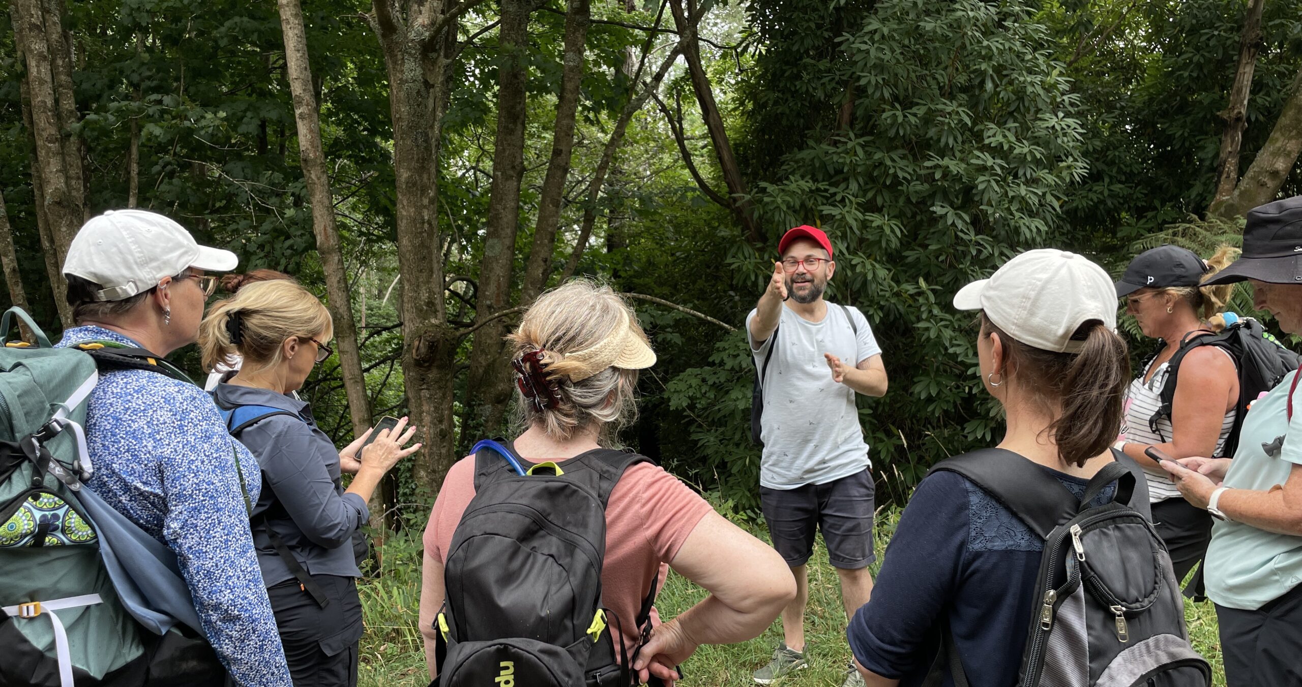 Impact Adventures team mid-challenge outdoors — the difference made visible